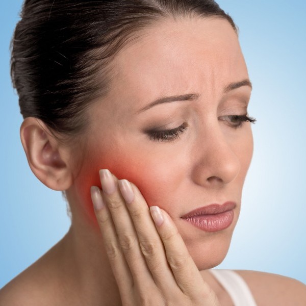 A woman with a tooth pain